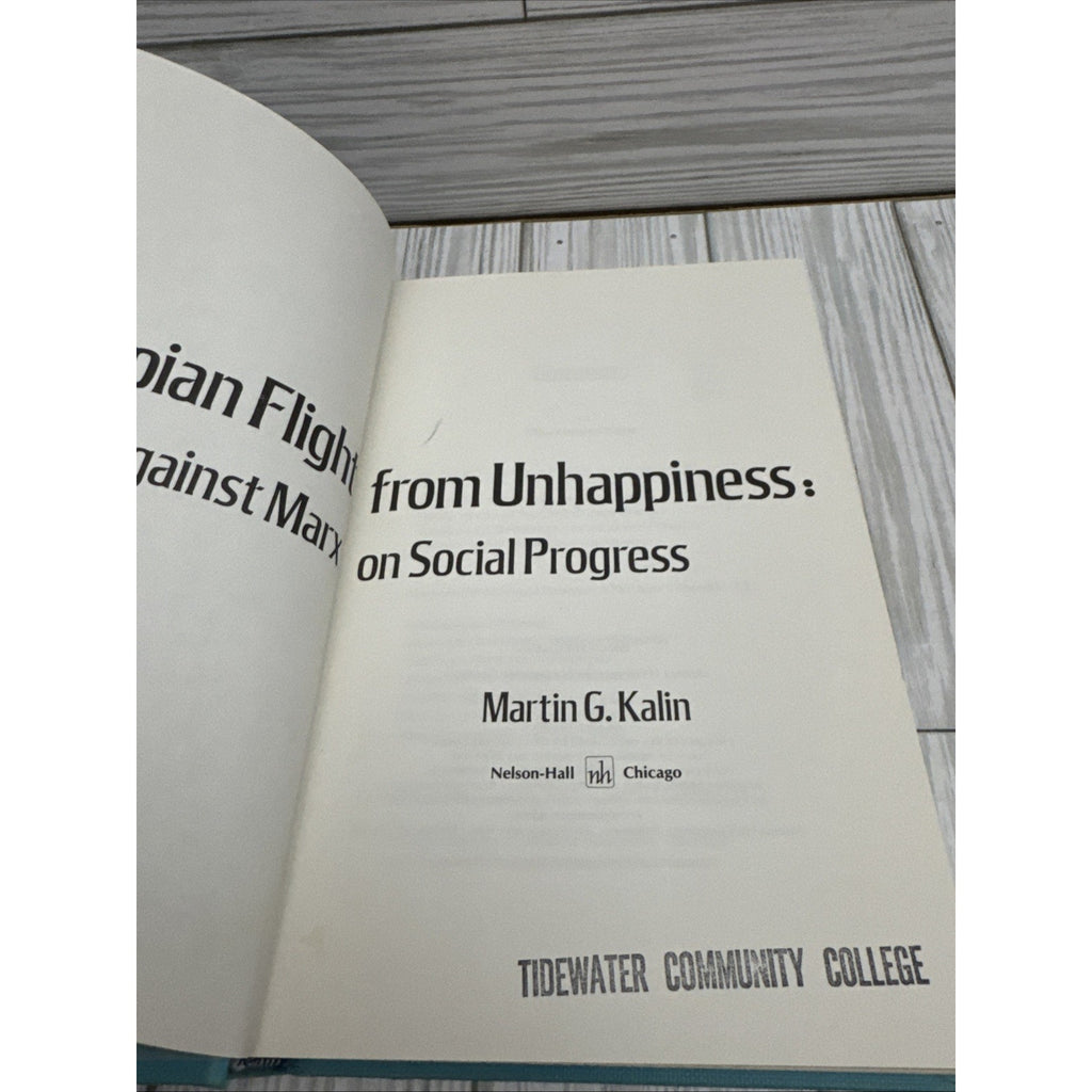 The Utopian Flight from Unhappiness : Freud Against Marx on Socia
