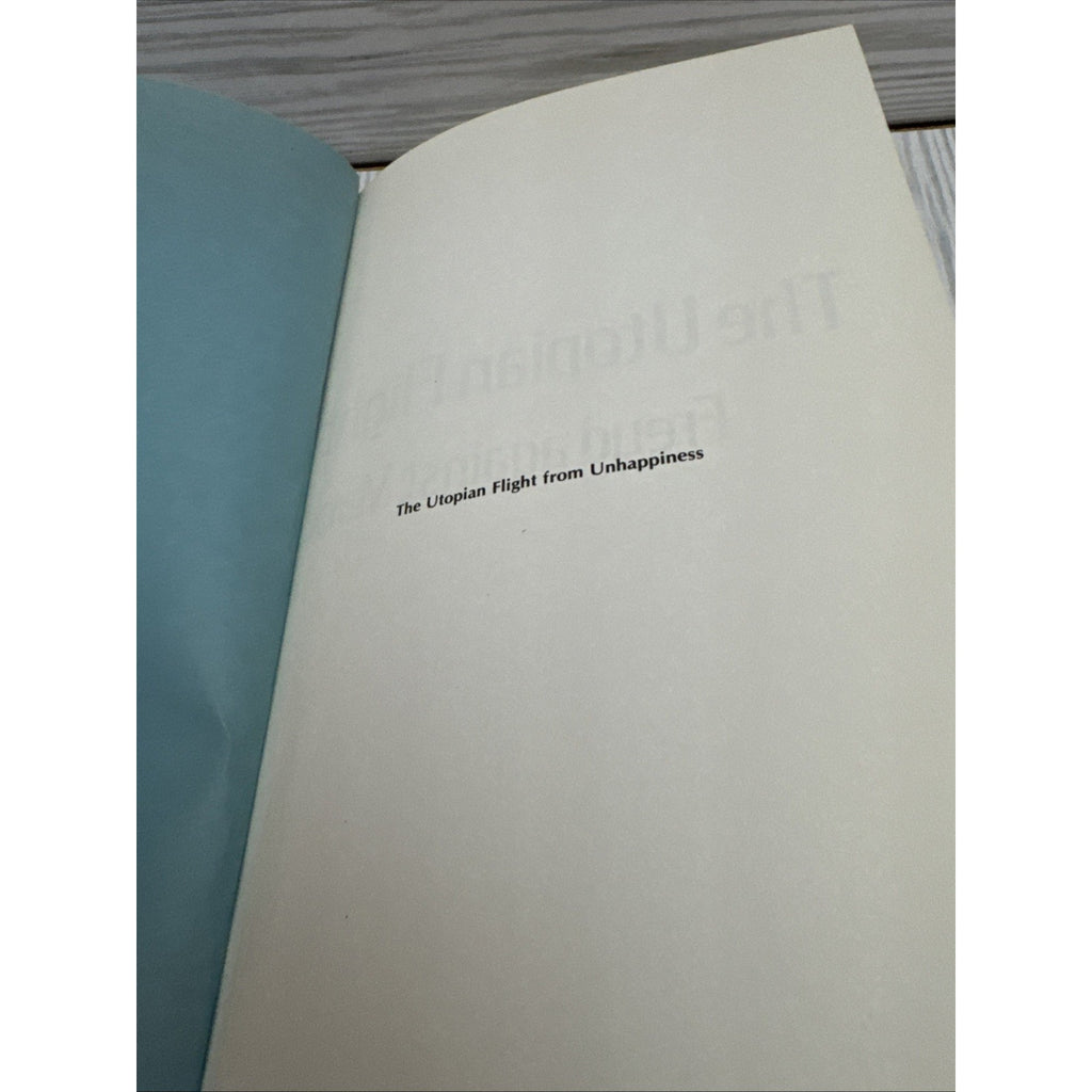The Utopian Flight from Unhappiness : Freud Against Marx on Socia